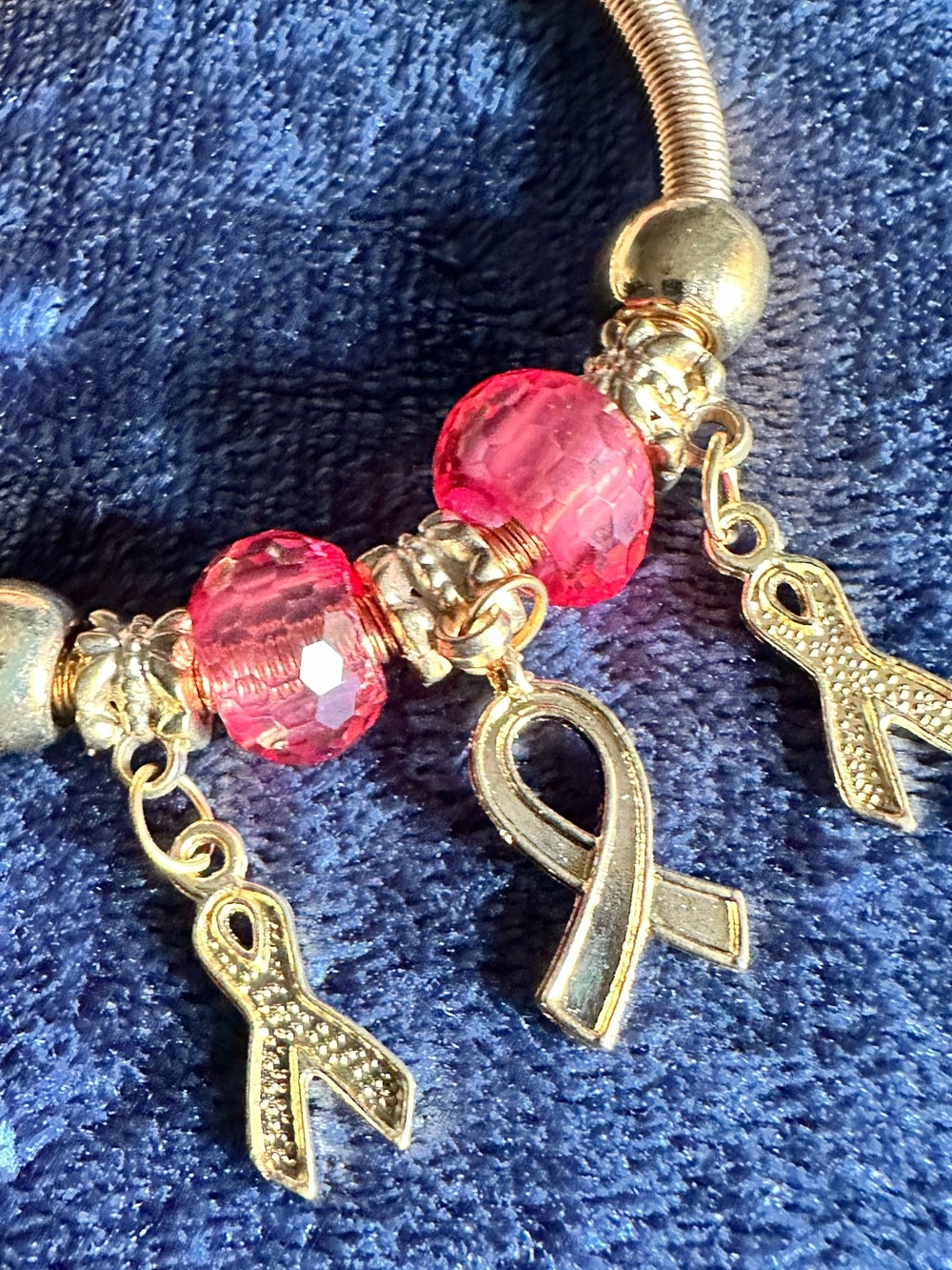 Gold Bracelet with Pink Crystal Beads and Ribbon Charms